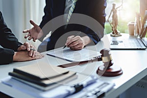 Law, Consultation, Agreement, Contract, Attorney or Lawyer holding a pen is consulting with a client to explain the