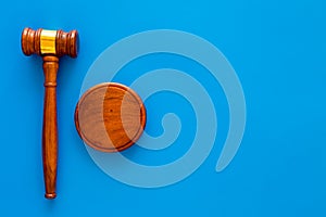 Law and court. Lawyer, attorney, judge concept. Judge gavel on blue background top view copy space