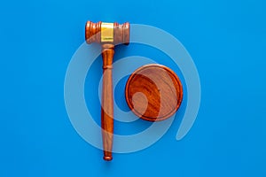 Law and court. Lawyer, attorney, judge concept. Judge gavel on blue background top view copy space