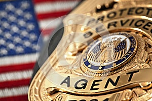 Law enforcement badge with gun, handcuffs and bullets photo