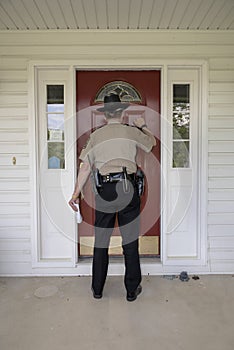 Law enforcement officer attempting to serve paperwork