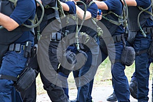 Law enforcement training team with tactical equipment and tactic