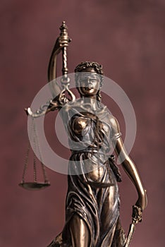 Law and judgment concept. Figure of Lady Justice in notary office close-up.
