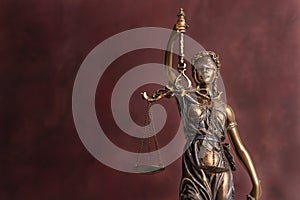 Law and judgment concept. Figure of Lady Justice in notary office close-up.