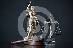 Law and Justice concept image, Lady Justice and gavel  on rustic books background