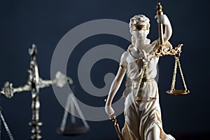 Law and Justice concept image, Lady Justice and gavel  on rustic books background