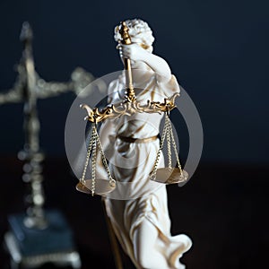 Law and Justice concept image, Lady Justice and gavel  on rustic books background