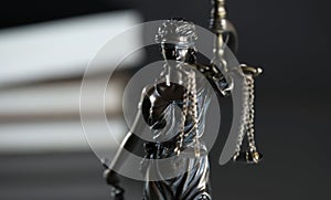 Law and Justice concept image, Lady Justice and gavel  on rustic books background