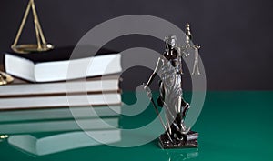 Law and Justice concept image, Lady Justice and gavel  on rustic books background