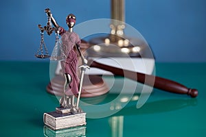 Law and Justice concept image, Lady Justice and gavel  on rustic books background