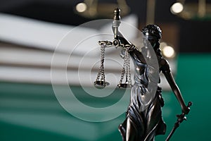 Law and Justice concept image, Lady Justice and gavel  on rustic books background