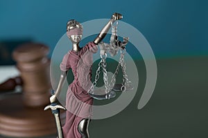 Law and Justice concept image, Lady Justice and gavel  on rustic books background