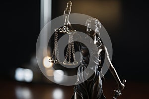 Law and Justice concept image, Lady Justice and gavel  on rustic books background