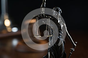 Law and Justice concept image, Lady Justice and gavel  on rustic books background