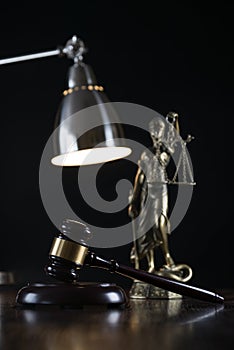 Law and Justice concept image, Lady Justice and gavel  on rustic books background