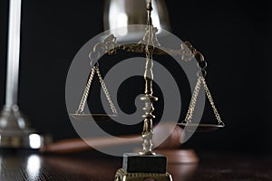 Law and Justice concept image, Lady Justice and gavel  on rustic books background