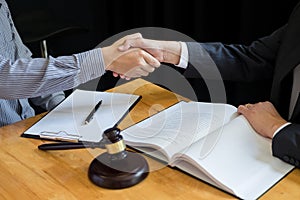 Law and Legal concept, Consultation between attorneys and clients customer shaking hands discussing contract agreement In