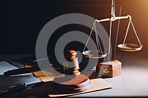law legal technology concept. judge gavel on computer with scales of justice on desk of lawyer