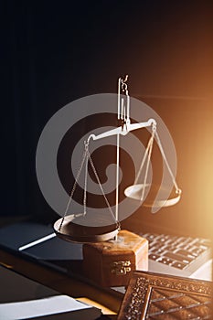 law legal technology concept. judge gavel on computer with scales of justice on desk of lawyer