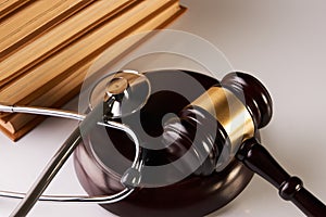 Law mallet or Judge gavel and medical stethoscope