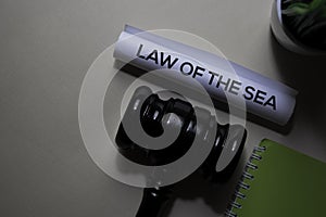 Law Of The Sea text on Document and gavel isolated on office desk. Justice law concept