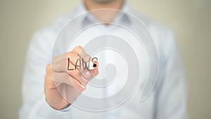 Law Suits, man writing on transparent screen