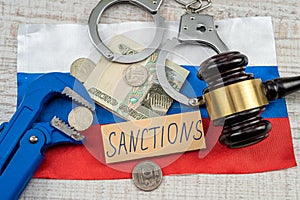 law wooden hammer with russian ruble sanction for country aggressor terrorist