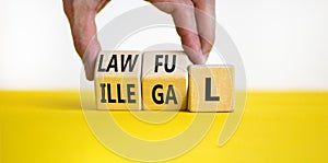 Lawful or illegal symbol. Concept word Lawful or Illegal on wooden cubes. Beautiful yellow table white background. Businessman