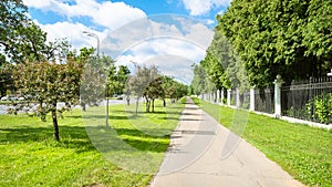 lawn with apple trees and pathway along garden