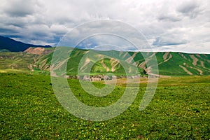 Lawn and mountains in Tekesi county photo