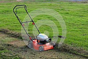 Lawn mower cutting grass