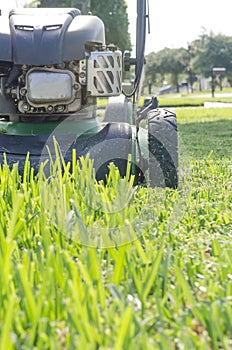 A Lawn Mower Cutting Summer Grass