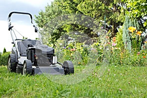 Lawn mower in the garden