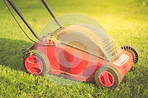 Lawn mower on the grass/lawn mower on the grass. Selective focus