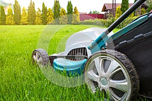 Lawn mowers close-up on a sunny day. Grass care. Gardening concept