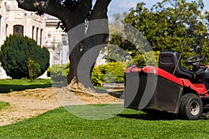 Lawn mowers cut grass. Garden work concept background