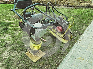 Lawn mowing machine. huge lawnmower on oil and gasoline. hand tool for creating a smooth landscape. metal construction with