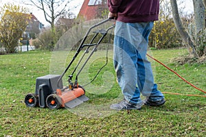 Lawn thatcher in action