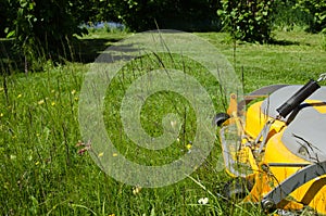 Lawncare with a riding mower photo