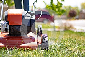 Lawnmower being used on front lawn