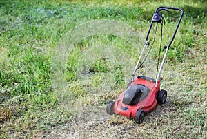 Lawnmower on green grass