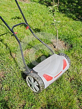 Lawnmower on green grass