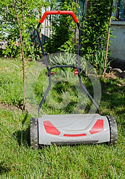 Lawnmower on green grass