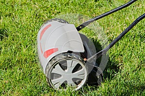 Lawnmower on green grass