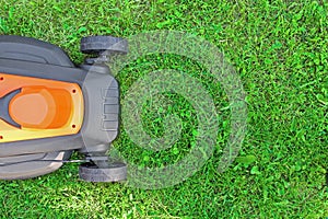 Lawnmower on green grass