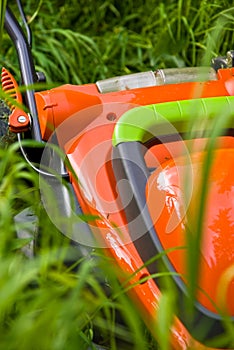 Lawnmower in long grass