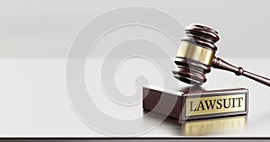 Lawsuit: Judge's Gavel as a symbol of legal system and wooden stand with text word photo