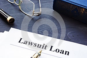 Lawsuit Loan form on a wooden desk.