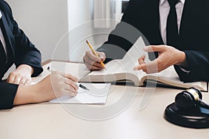 Lawyer and attorney having team meeting at law firm.