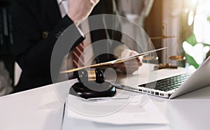 Lawyer business man working with paperwork on his desk at office.